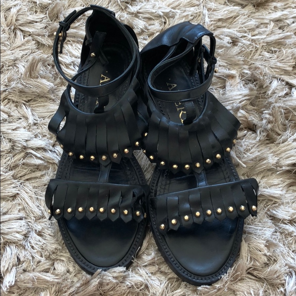 Black Aperlai gladiator sandals.